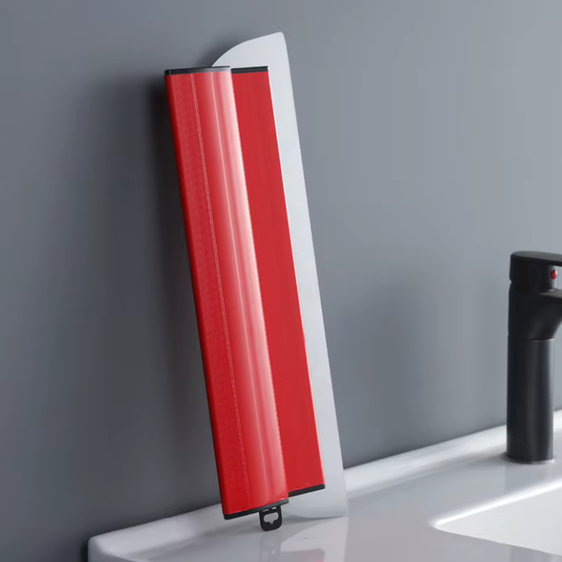 Spatule de lissage pour cloisons sèches