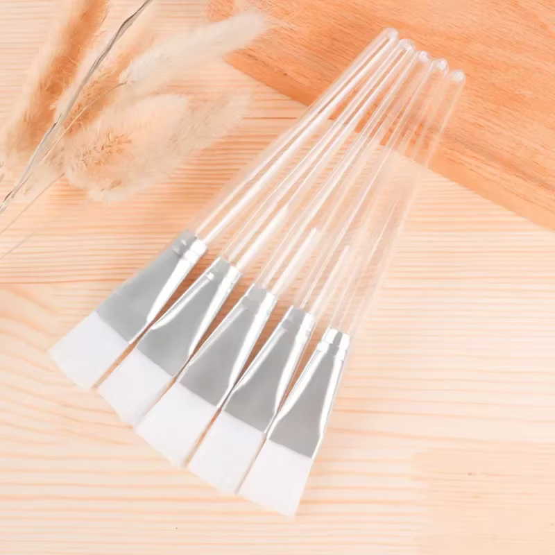 Brosse à masque à poignée transparente
